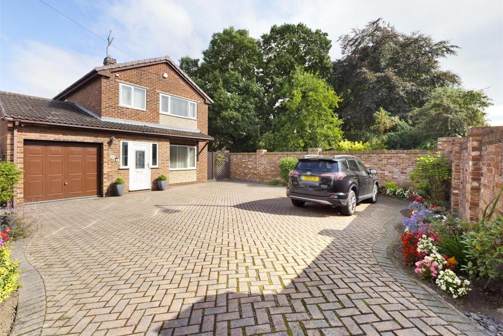 Doncaster Road, Kirk Sandall - Front with boundary wall and fence, block paved, flower beds, a variety of flowers, plants and shrubs, side timber access gate and wrought iron gate providing access to the rear garden.