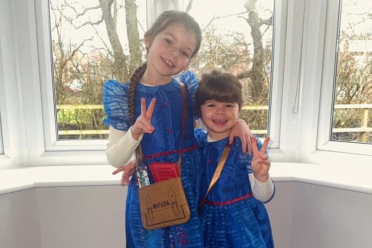 Evie and Emmy dressed as Matilda.