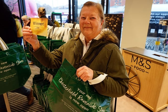 Eileen Bird was one of the first customers through the doors - and can be seen here with her golden ticket.