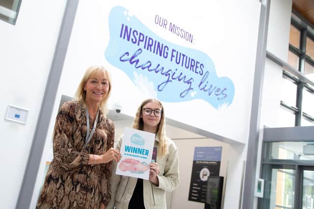 Julie Richards, Principal and Chief Executive of Chesterfield College presenting Emily Machin with her prize and certificate