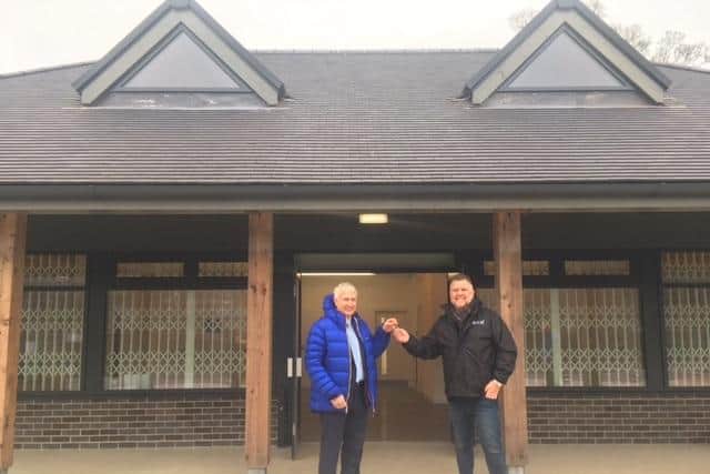 Councillor Tony Harper, the council’s cabinet portfolio holder for Regeneration and Community Safety, hands the keys to the tea rooms’ general manager, Darren Steels.