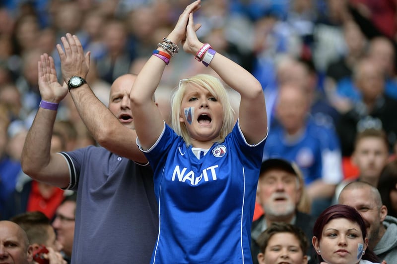 Chesterfield fans celebrate as they score early in the second half.