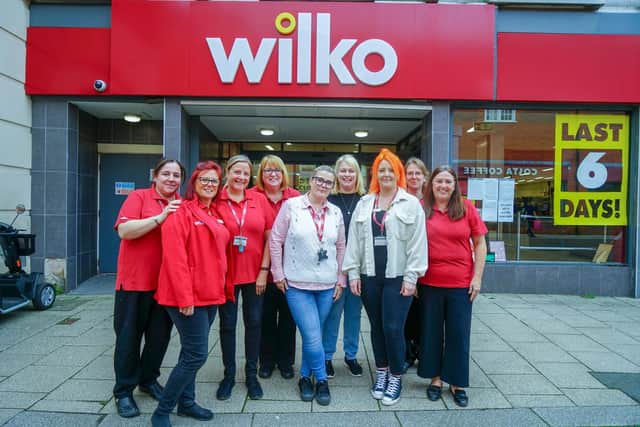 Staff outside the shop this week ahead of its closure