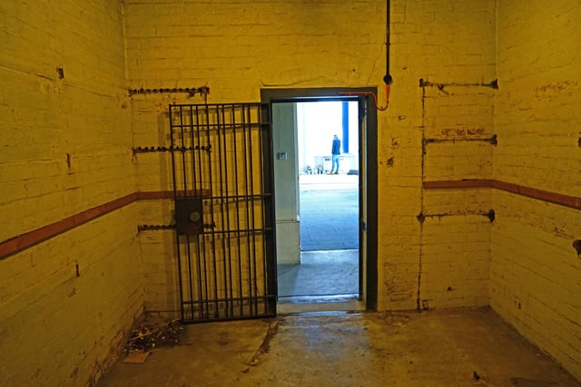 Now resembling an old-fashioned prison cell, this room would probably have been secured by a heavy door with multiple locks and bolts when it was part of the bank.