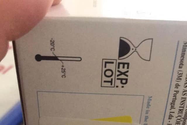 A use-by sticker saying 31/08/19 is over a sticker with the year 2016 on this box of masks.