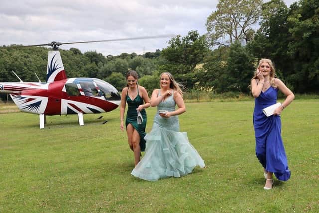 Brooke Sheehan, Gracie Owen and Hannah Mansell, left to right, arrive by helicopter for Netherthorpe School's prom at Ringwood Hall Hotel, Brimington (photo: Dave Dudley)