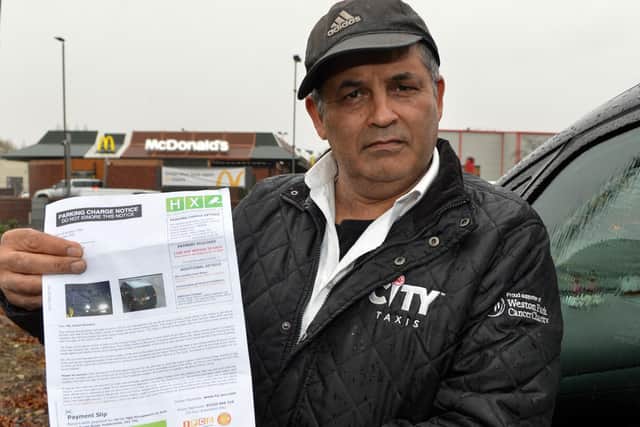 Taxi driver Alnoor Mamdani is angry after being slapped with a £100 parking fine in Chesterfield. Picture by Brian Eyre.