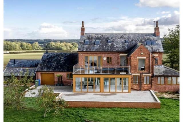 This superb, six-bedroom, detached property in rural seclusion on Ratcliffe Way, Hodthorpe, Worksop is on the market for £1.1 million with estate agents Purplebricks. The photo shows the back of the house, with its balcony and raised terrace.