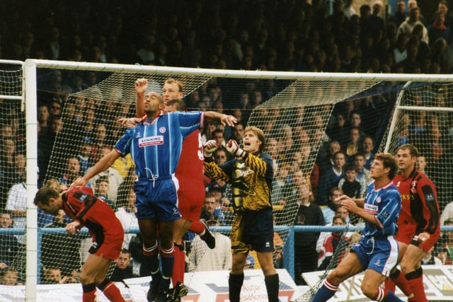 Chesterfield's September 1998 game against Walsall.Jason Lee being outmuscled at a corner, probably to the relief of goalie Jimmy Walker, who appears out of position and flat-footed.