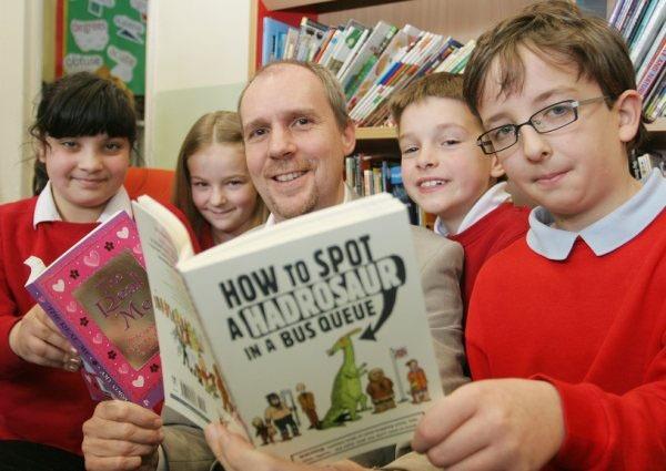 Ellis Carey, Brandon Strowunski, Jordan Bradfield and Jemma White, with author Andy Seed, at the opening of Unstone Junior School library.