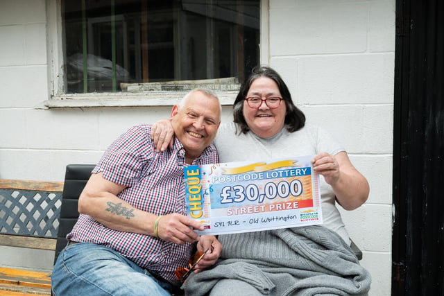Grandmother of 11 Lorraine Lawton scooped £30,000.
After her cheque was revealed her partner, David said: “It’s about time you had some luck, well done sweetheart.”
Lorraine said: “I’ve not had a good couple of years. I’ve had a leg off and two stokes.
Lorraine also plans to use some of the winnings to pay a touching tribute to her late grandson.
She said: “My grandson was born stillborn about 10 years ago. I’m going to pay for him to have a proper headstone and grave.”