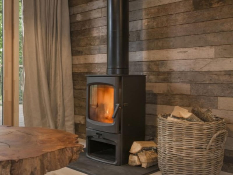 A wood burner keeps things cozy inside.