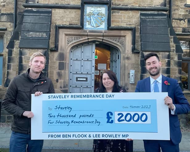 Ben Flook and Lee Rowley hand over the cheque to the Town Clerk of Staveley Town Council, Sabrina Doherty