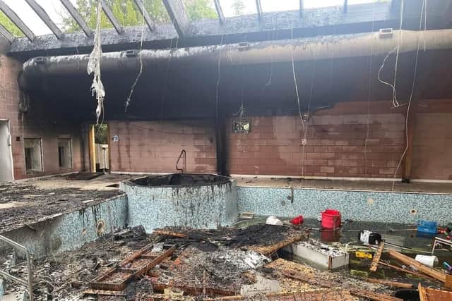 The old swimming pool sustained serious damage in the fire.