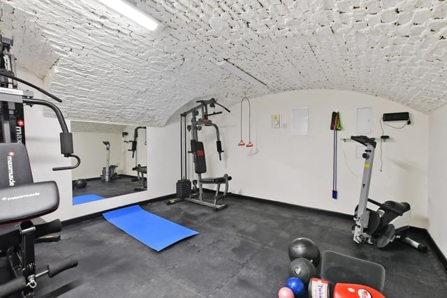 The cellar has been tanked and insulated and is currently used as a home gymnasium.
