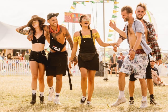 Happy revellers caught on camera in Sgt Pepper Meadows at the 2018 festival by MaxMiechowski.