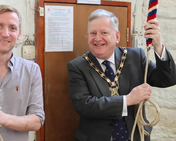 Lee Rowley, MP for North East Derbyshire and Martin Thacker, chairman of North East Derbyshire District Council, ring the bells at All Saints Church, Wingerworth.