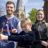 Adam Stickler, Clara Coslett and Eddie Waller (front) promote The Crooked Spire musical in Chesterfield on Good Friday  (photograph: Tom Humphries/Ashgate Heritage Arts).