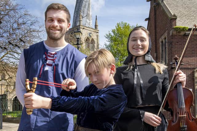 Adam Stickler, Clara Coslett and Eddie Waller (front) promote The Crooked Spire musical in Chesterfield on Good Friday  (photograph: Tom Humphries/Ashgate Heritage Arts).