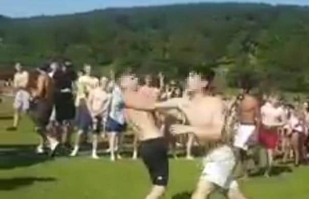 A fight breaks out as a huge crowd gathers at Chatsworth in the Peak District