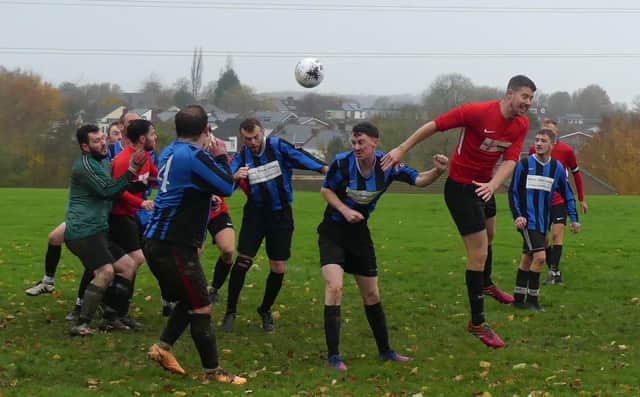 Action from the clash between Shinnon (red) and Poolsbrook Town, which Shinnon won 6-1.