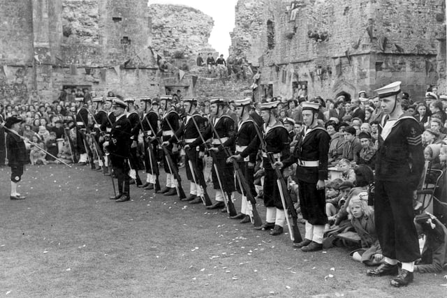 Guarding the May Queen. Taken at Portchester Castle in 1951 we see  boys of the Fareham Sea Cadets fell-in and standing at ease as Guard  of Honour to the May Queen of that year.