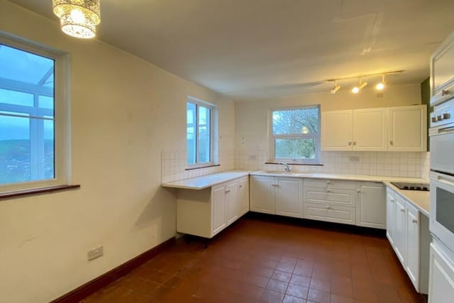 The kitchen is large enough to accommodate a dining table and chairs. The fitted units have roll top work surface and tiled splashbacks. There is an integrated electric oven and hob.