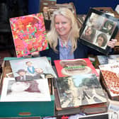 Claire Howell, music memorabilia consultant at Hansons, with Beatles records.