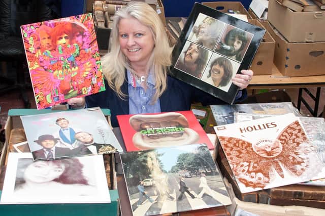 Claire Howell, music memorabilia consultant at Hansons, with Beatles records.
