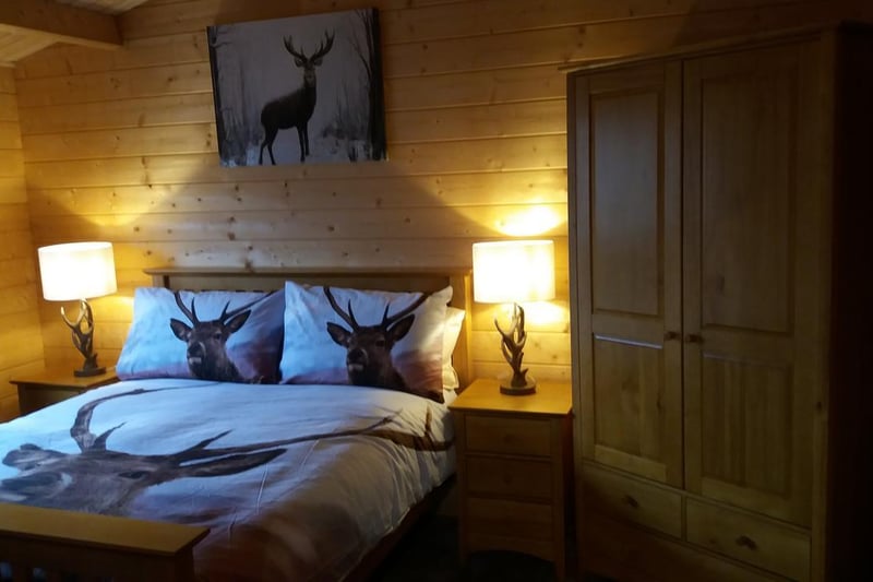 This cute chalet near Airdrie, in North Lanarkshire, has two bedrooms, free wifi, and private parking on site. Lochinvar log cabin with hot tub also has a garden with a barbecue and great hiking routes nearby.
