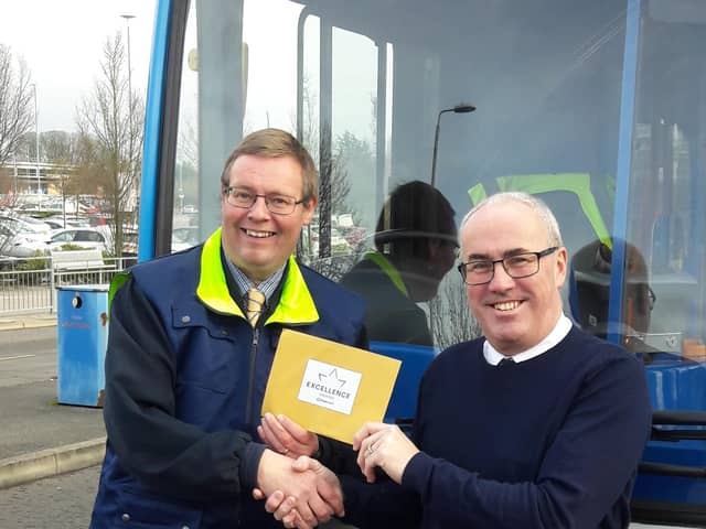 Andrew receiving his golden ticket from Commercial Director John Young