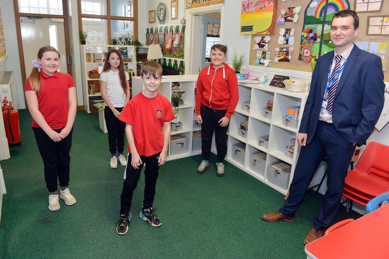 Pictures of first day back at school as children return to class in ...