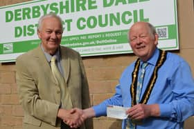 Peter Savidge, left, handing over the donation to Councillor David Burton. (Photo: Derbyshire Dales District Council)