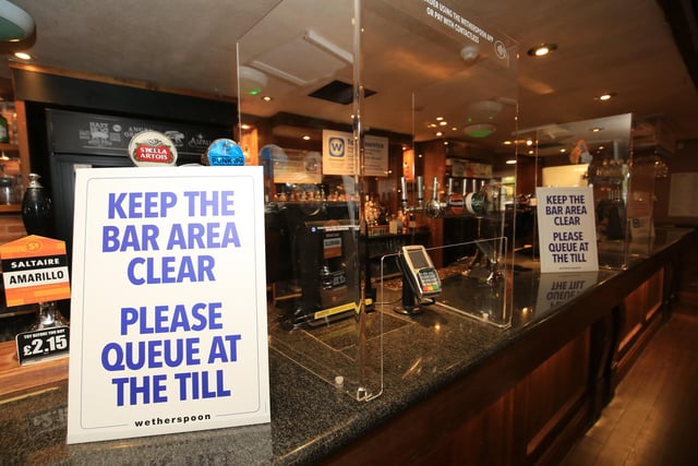 Screens have also been installed at the bar to keep staff and customers safe. Picture: Chris Etchells
