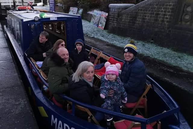 Archie and family on the canal boat named Madeleine, in memory of his sister who died.