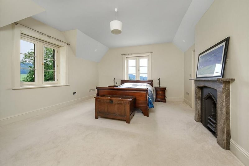 The principal bedroom has views across the neighbouring countryside.