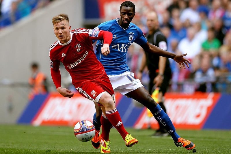 Simon Ferry (L) in action with Alex Mendy during the Johnstone's Paint trophy Final between Swindon Town and Chesterfield at Wembley Stadium on March 25, 2012.