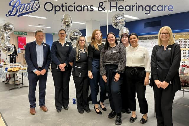 Boots Opticians Chesterfield team posing in front of their newly refit store