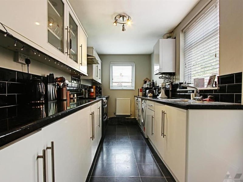 A fitted kitchen boasts all the modern amenities. It is bright and well presented, and has a door giving access to the garden.