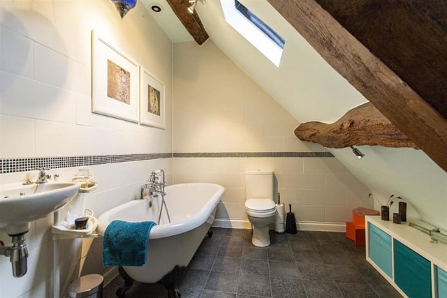 The third bedroom's ensuite has a rolltop bath with shower mixer tap, wash basin and wc.