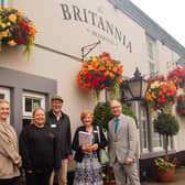 The Britannia Inn at Brampton won a Gold Award in East Midlands In Bloom. Judges John Constable, centre and Julie Walker, second right, are pictured with Coun Jonathan Davies and representatives from the pub including landlady Jody Wray.