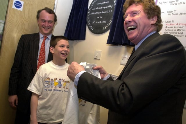 Michael Crawford - star of the theatre and, as the hapless Frank Spencer, the sitcom Some Mothers Do 'Ave 'Em - shares a joke with patient Jonathon Jellie and chairman Stephen Catlin as he opens the hospital's Treetop House in 2001.