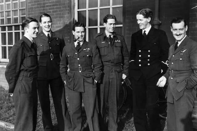 January 1943:  Wing Commander Guy Gibson (smoking pipe), and members of his Lancaster bomber air crew after a bombing raid on Berlin.  Gibson later led the 'Dambusters' raid.  (Photo by Central Press/Getty Images)