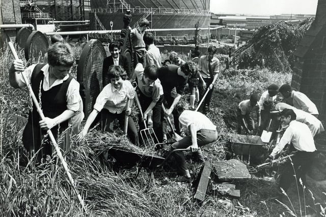 Clearing up the graveyard at St Thomas Church, Brightside as part of Springclean 69 are these 4th formers from Hinde House Comprehensive School, Sheffield in July 1969.