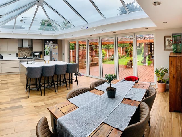 The bi-folding doors open onto the garden creating a "beautiful space for entertaining". The glass roof and double glazed window to the side provide this room lots of natural lighting, there are two radiators and porcelain tiled flooring.