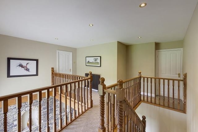 This gallery landing leading to three bedrooms and a bathroom is reached via an oak staircase with a timber hand rail.