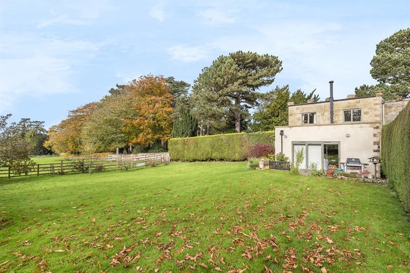 The property sits in an elevated position offering wonderful views far reaching views, with the rear garden overlooking the adjoining countryside, while to the west is a private space for entertaining.