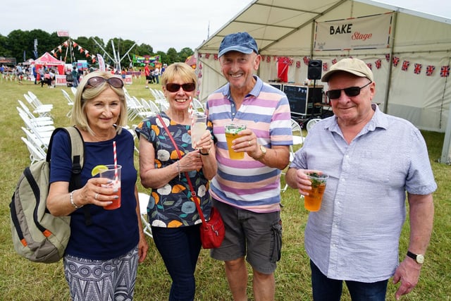 The Great British food festival returns to Hardwick Hall. Russ and Bev Lock and Susan and Barry King enjoying a drink.