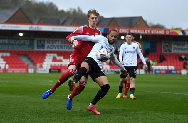 ACCRINGTON, ENGLAND - APRIL 27: Marcus Myers-Harness of Portsmouth is tackled by Harvey Rodgers of Accrington during the Sky Bet League One match between Accrington Stanley and Portsmouth at The Crown Ground on April 27, 2021 in Accrington, England. Sporting stadiums around the UK remain under strict restrictions due to the Coronavirus Pandemic as Government social distancing laws prohibit fans inside venues resulting in games being played behind closed doors. (Photo by Gareth Copley/Getty Images)