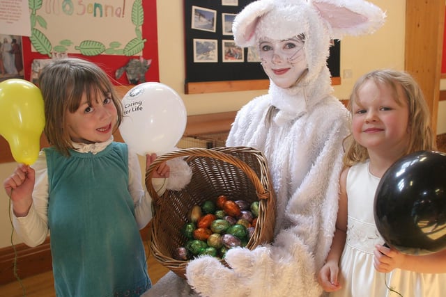 Five-year-olds Heather Tomlins and Felicity Kay with St John Ambulance cadet Katie Duncan at an Easter bunnies picnic, organised by the Bakewell branch  of St John Ambulance.